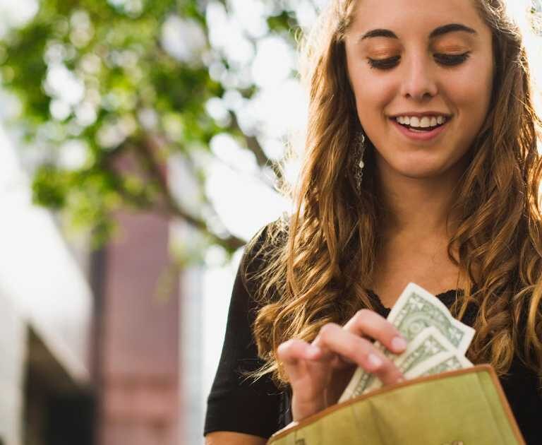 Young woman avoiding debt at a young age