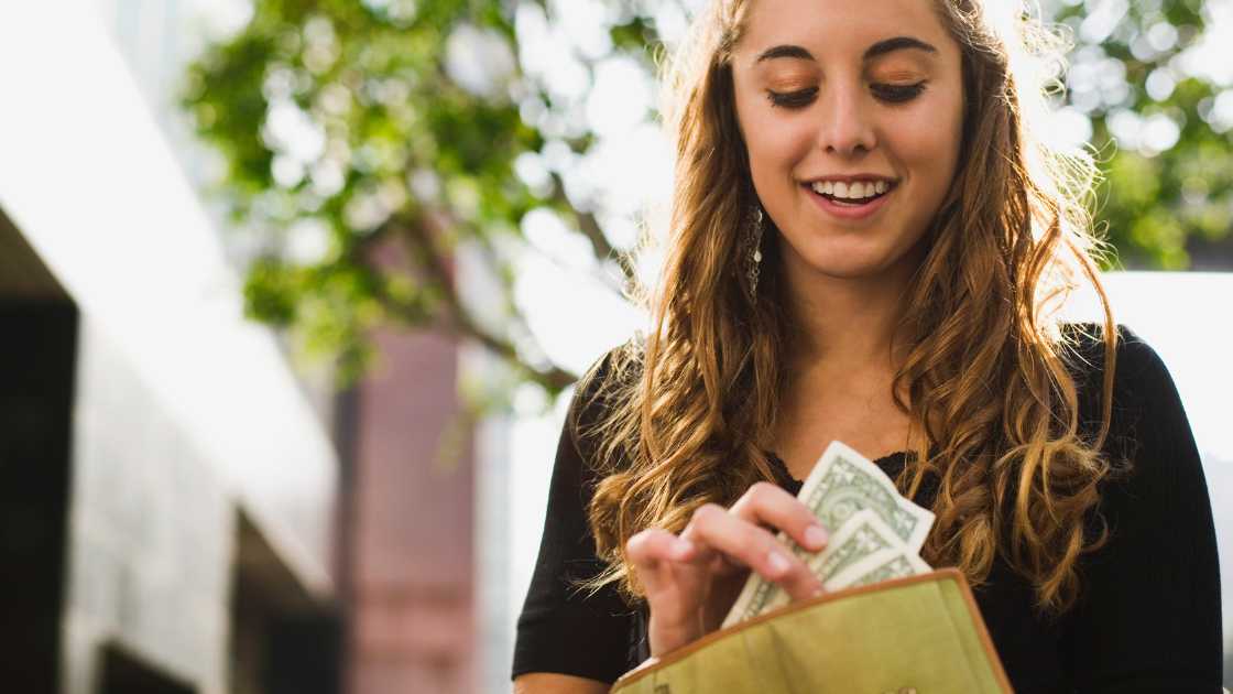 Young woman avoiding debt at a young age